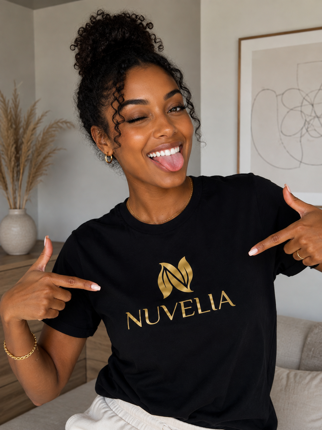 Model wearing Nuvelia black tee